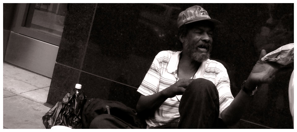 A man excitedly receives a bag lunch